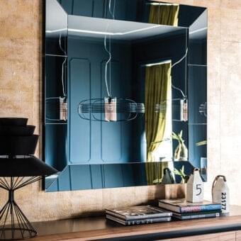 Distinguished Cattelan Italia Regal mirror with geometrically beveled edges and fumé mirrored glass panels crafted in Italy