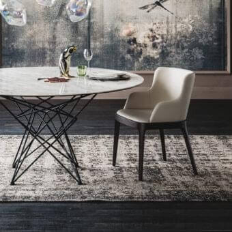 Elegant Cattelan Italia Magda chair with enveloping backrest and solid dark wood frame in neutral textile upholstery