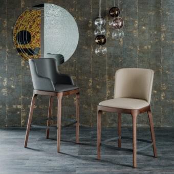 Elegant Cattelan Italia Magda stool with dark gray upholstered seat and dark-finished solid ash wood frame built with a metal footrest
