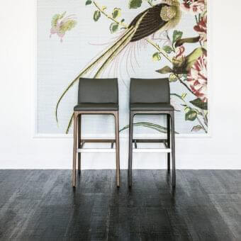 Exceptional Cattelan Italia Arcadia stool with wengè-stained beech frame and dark gray synthetic leather seat built with a metallic footrest