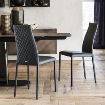 Distinctive Cattelan Italia Kay Couture chair fully upholstered in quilted synthetic material with sleek steel legs