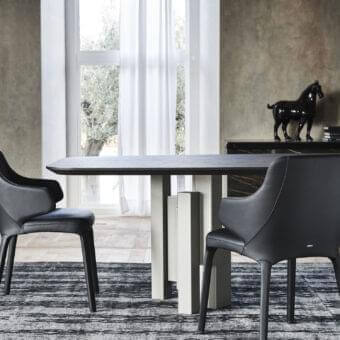 Distinguished Cattelan Italia Wanda armchair with sleek black soft leather and curved steel frame construction