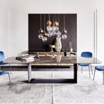 Elegant Cattelan Italia Dragon table with dark grey ceramic tabletop and matte black embossed lacquered steel base