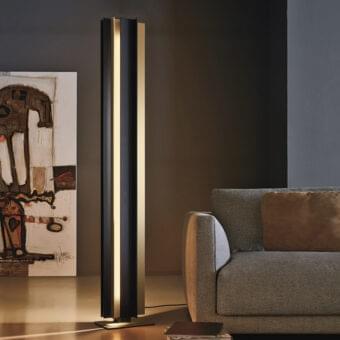 Distinguished VENICEM Secret Floor Lamp lighting crafted with light burnished brass and matte black metal delivering warm diffused illumination
