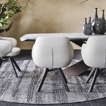 Superior Cattelan Italia Bombè armchair with light grey upholstery and Canaletto walnut stained legs built with a graphite embossed lacquered steel base