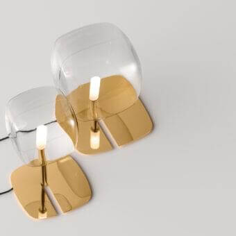 Distinguished Tonelli Design Hyperion lamp with transparent blown pyrex glass diffuser and reflective golden metallic structure