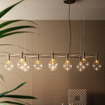 Refined Bonaldo Sofi suspension lamp with warm amber borosilicate glass globes and burnished brass cylinder supporting clear glass spheres
