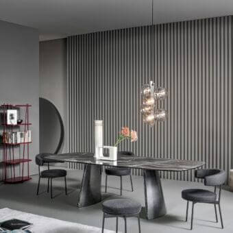 Elegant Bonaldo Torii table with oval top crafted from ceramic displaying grey veining and matching metal base finish