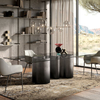 Distinguished Cattelan Italia Papel table with a clear glass top and curved metal base in a gradient dark tone finish