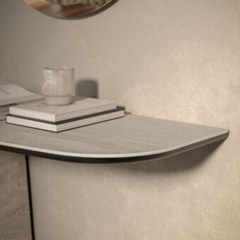 Elegant Cattelan Italia Rado Keramik console with gracefully curved shapes and light gray ceramic top exhibiting a textured finish