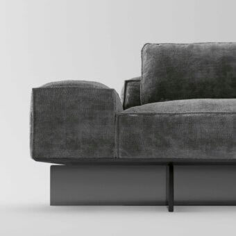 Sophisticated Tonelli Design sofa with dark gray textile upholstery and smoked glass base showcasing precise double stitching