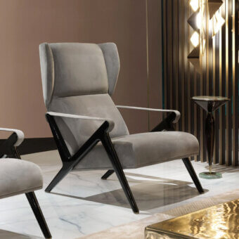 Sophisticated Visionnaire Imagine lounge chair with glossy black lacquered legs and smooth matte gray textile upholstery