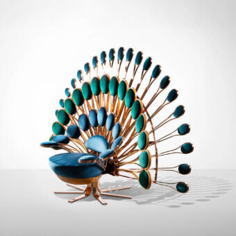 Luxury Visionnaire Pavone Throne lounge chair upholstered in deep teal fabric with a satin bronze cast brass backrest and leather base