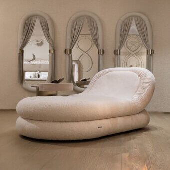 Avant-garde Visionnaire Fedro chaise lounge upholstered in plush pale beige textile with a curved profile