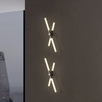 Distinguished Contardi Bianca wall lamp crafted in Italy with milky white glass and smooth matte metal base