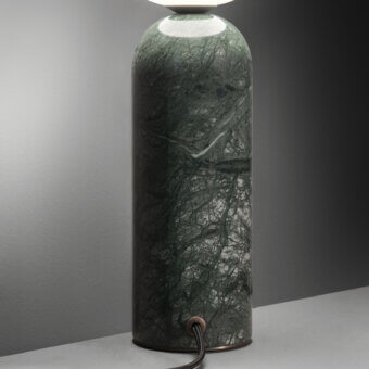 Refined Contardi Emma table lamp crafted in green marble with a white opal glass sphere and muted bronze metallic connector