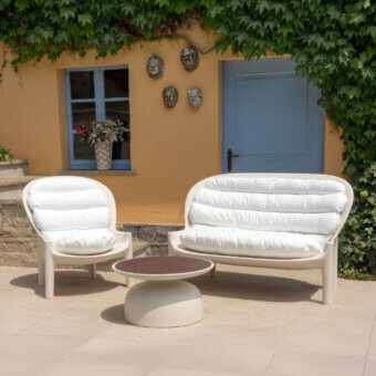 Exceptional Serralunga Balzac lounge chair with sculpted form built in matte off-white recyclable LLDPE and plush cushions