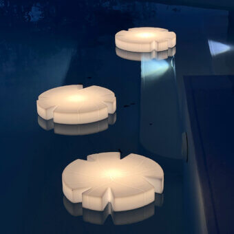 Elegant Serralunga Fiore Di Loto floating table crafted with durable recyclable LLDPE in an opaline finish for outdoor spaces
