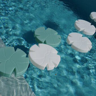 Distinguished Serralunga Fiore Di Loto floating table with pale green LLDPE and opaline finish offers a contemporary design