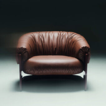 Elegant Visionnaire Hampshire lounge chair in cognac‑tone leather with high‑gloss polyester birch base
