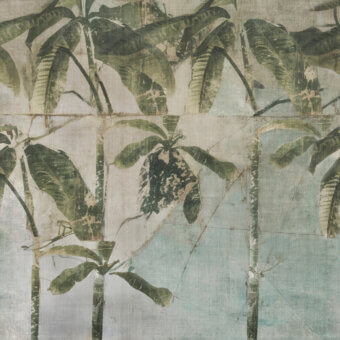 Distinguished Wall&Decò La Aldaba wallpaper with stylized banana leaf pattern in muted green and beige organic bio-vinyl and d.TW finish