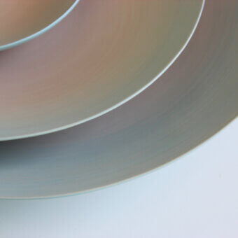 Exceptional Rina Menardi Gusci Shells centerpiece with gradient peach, grey, and pale blue tones in satin finish