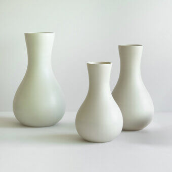 Elegant Rina Menardi Lepos vase crafted in muted pale green ceramic with a smooth matte finish