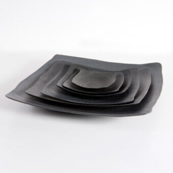 Exceptional Rina Menardi Quadri centerpiece crafted in textured wood with a dark gray finish for layered display