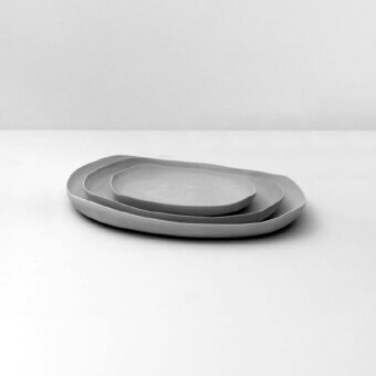 Superior Rina Menardi Quadritondi centerpiece crafted in Italy with organically shaped matte ceramic dishes and smooth finish