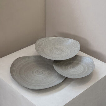 Exceptional Rina Menardi Triangolo centerpiece, a skilled Italian arrangement in matte gray ceramic with incised lines