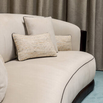Sophisticated Bellotti Ezio 2026-01 sofa in cream matte Tecnabuk with brown piping, glossy hide base and textured beige gold cushions