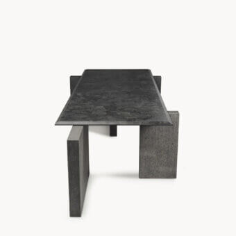 Luxury Visionnaire Axiom table with charcoal grey granite top, textured leather finish, beveled edges, bases, flamed Nero Zimbabwe stone plate