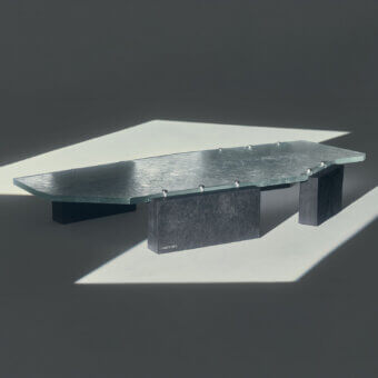 Sophisticated Visionnaire Stealth coffee table with light-grey textured glass and dark charcoal split Moltrasio stone
