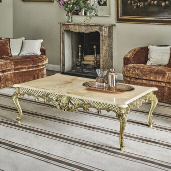 Elegant Bellotti Ezio coffee table with dark-veined Honey Onyx marble top and metal base with SG Silver Gold leaf and legs