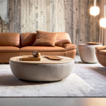 Luxury Ditre Italia Deck coffee table with light‑beige smooth MDF tabletop reflecting matte finish and greige upholstered base