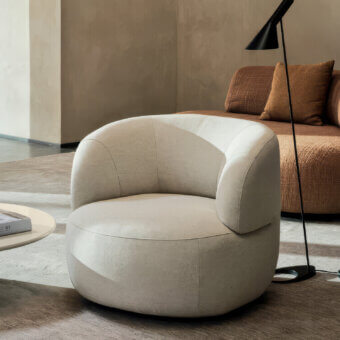 Luxury Isla lounge chair with solid fir wood and light beige matte textile in railroaded vertical finish