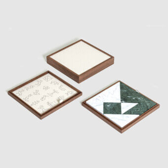 Premium Pinetti Tangram Box with walnut wood frame, satin‑matte grain, white linen lining, and marble triangles squares parallelograms
