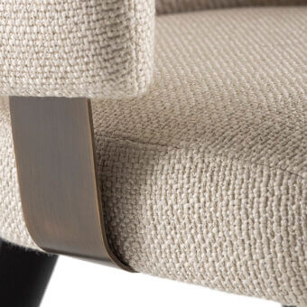 Exclusive Rugiano Charlotte armchair with beige‑cream upholstered armrest, matte black metal legs, bronze band base
