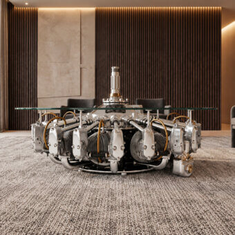 Exquisite Arteinmotion coffee table with mirror polished radial engine base glass top yellow gold accents