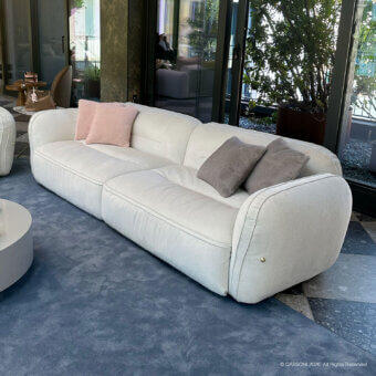 Sophisticated Furla Casa Moonstone sofa in cream textile with low profile organic silhouette and black beech wood feet