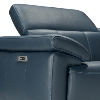 Elegant Castello Smile sofa in dark blue matte upholstery with light contrast stitching and integrated reclining controls