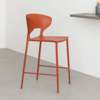 Luxury Desalto Koki barstool in burnt orange polyurethane with internal steel structure plus matte metal slender legs