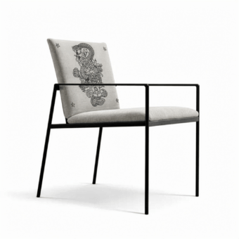 Luxurious JR Home John Richmond armchair in light grey fabric with black glossy metal frame and laser etched tattoo graphic