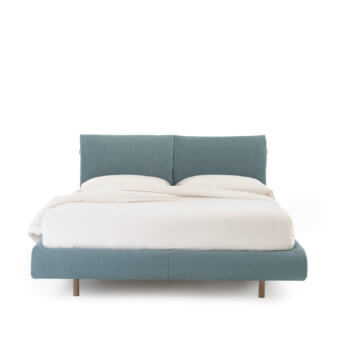 Luxury Noctis Mio bed in textured blue fabric with matte finish, clean solid wood frame and cylindrical legs