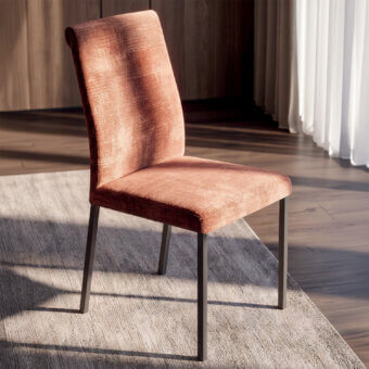 Sophisticated Ozzio Italia dining chair in textured terracotta fabric with dark metal frame