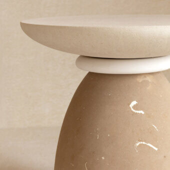 Luxurious Apospersano coffee table crafted from stone featuring a matte textured warm beige palette