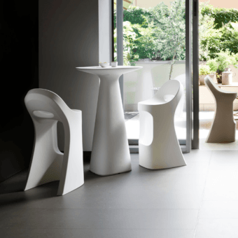 Luxury Slide Amélie stool crafted from white polyethylene in a smooth matte finish with fluid organic sculptural design