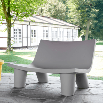 Luxury Slide Low Lita Love sofa in light gray polyethylene with a monolithic silhouette flowing organic curves matte finish
