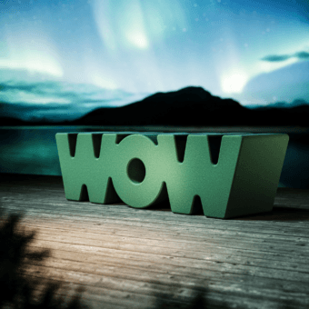 Luxury Slide Wow bench in medium green polyethylene with a matte finish and an innovative monolithic typographic form